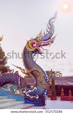 Serpent at Buddhist temple in Chiang Rai, Thailand. It is a mythical animal which was created in front of the main chapel at Buddhist temple as a holy guardian