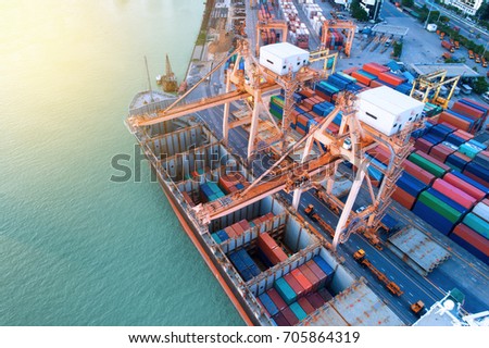 Container ship in import export and business logistic, By crane, Trade Port, Shipping cargo to harbor, International transportation, Business logistics concept, Aerial view from drone.