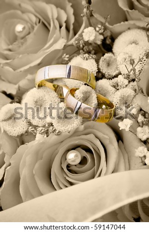 stock photo wedding rings on the flowers