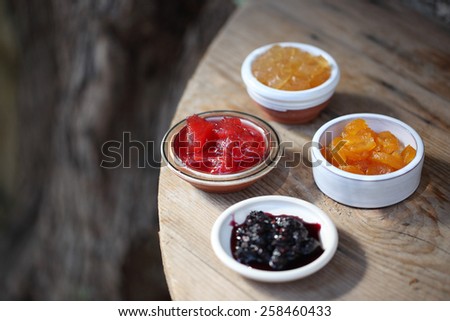 breakfast on wood table fruit jelly jars