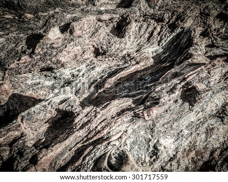 natural rock texture on the seashore  with soft vignette to create the artistic focusing effect on image