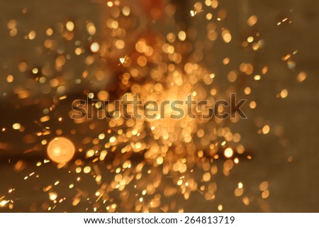 Blurred sparks from grinding steel.