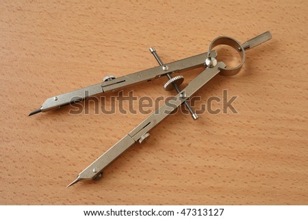 Compasses. Close-up. Isolation on a gray background.