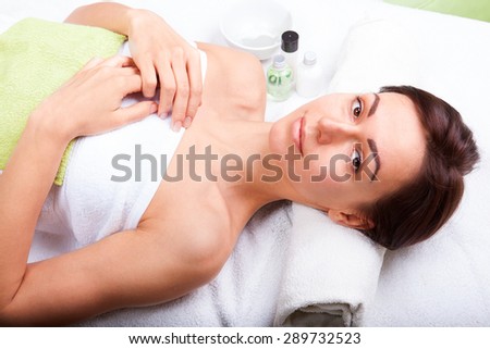 Closeup portrait of attractive gentle female enjoying day spa in luxury beauty salon, alternative medicine, harmony and inner peace concept