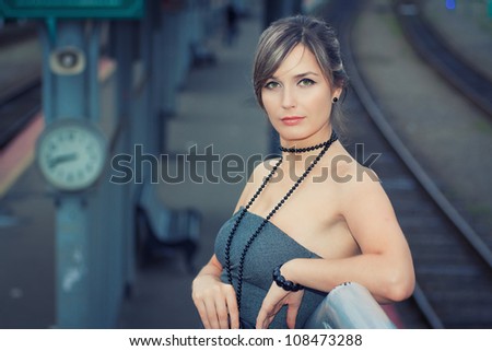 young girl at the train station