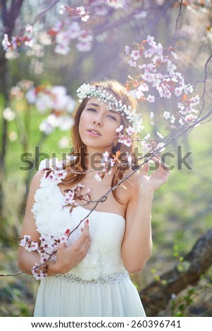 Bride with her hair in a spring garden