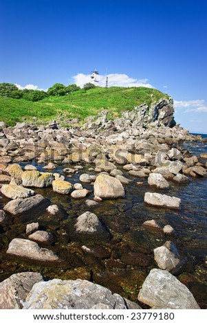 Lighthouse on stones 3