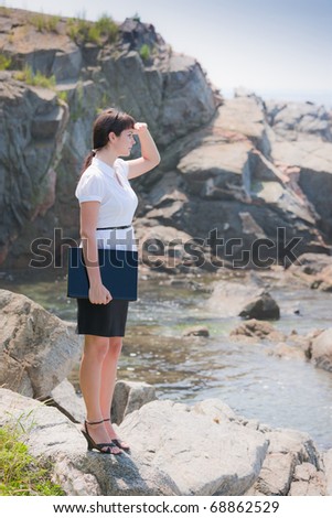 beautiful young sexy business woman with laptop at the sea
