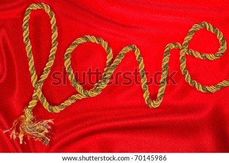 love the inscription in gold thread on red satin
