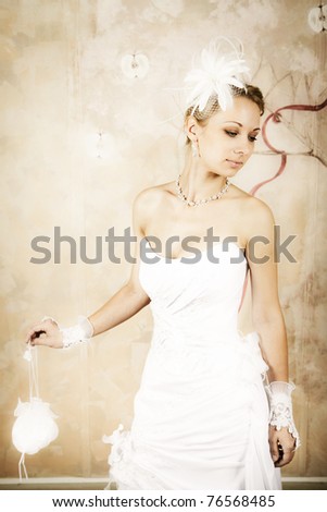 stock photo Beautiful shapely bride in an elegant wedding dress on a 