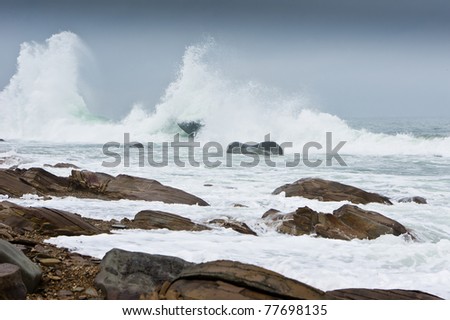 storm waves rolled on rocky shore