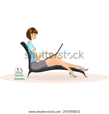 Attractive woman wearing glasses working on her laptop computer at home. Mug with words I love my job on it standing on pile of books nearby. Freelance, distant work, flexiplace concept