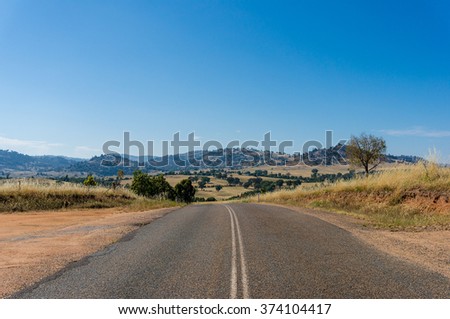 Australian outback road. Rural road on sunny day. Young region, NSW, Australia