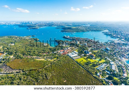 Aerial view Sydney Bay. View on Sydney harbourside suburbs from above. Aerial view on Sydney harbourside, Sydney CBD, Manly, Parramatta and Sydney Harbour National Park