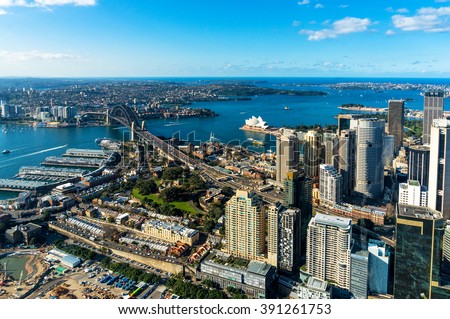 Aerial photo of Sydney CBD with skyline and Harbour bridge. Sydney iconic Harbour Bridge and CBD office buildings. Bird\'s eye view from above on Sydney CBD and Sydney Harbour