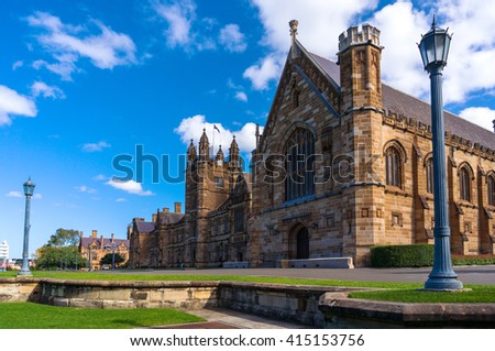 Sydney Uni building facade. University of Sydney against deep blue sky with white clouds, daytime photo