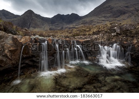 The Fairy Pools on a typical Scottish day. Threatning clouds hanging over the Cuillin range.