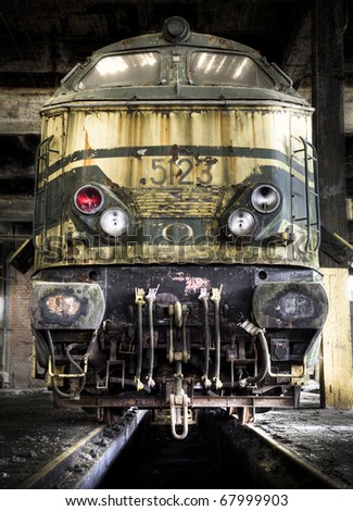 An old spooky train, left at an abandoned train workshop.
