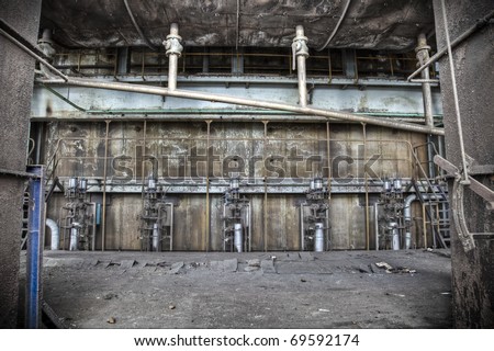 A grungy scene at an abandoned factory hall, rust and paint peeling from the walls creating a magnificent view.