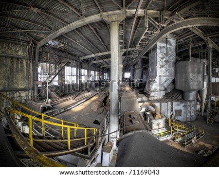 An overview of this upper deck hall at an abandoned factory. The days workers used to walk this deck are over thanks to the crisis.