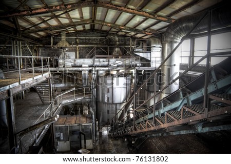 An abandoned sugar factory at it\'s best, rusted steel, dusty stairs and gigantic halls complete this great scenery.