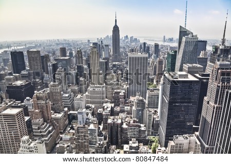 An aerial view over New York city, with the Empire State building in front. Amazing overlook at this big city.