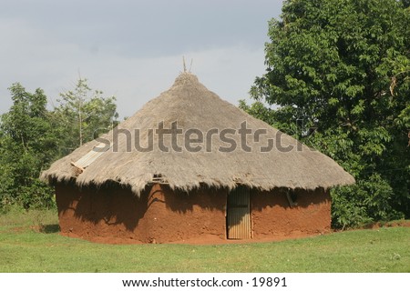 Mud House with Thatched Roof in Africa