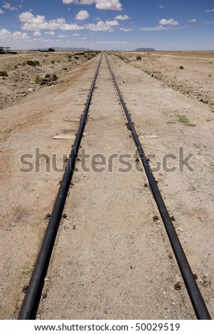 Abandoned old rail tracks leading to nowhere in Bolivian desert