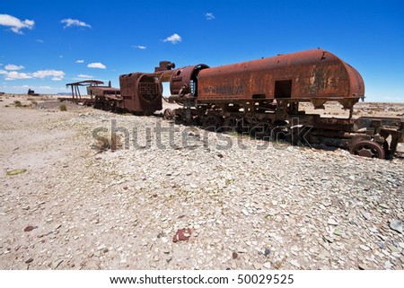 Graveyard of rusty old steam trains in Bolivian desert near Uyuni