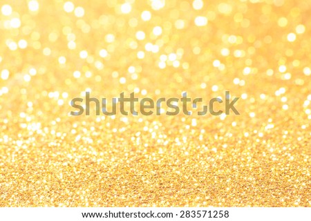 gold and white bokeh lights defocused. abstract background