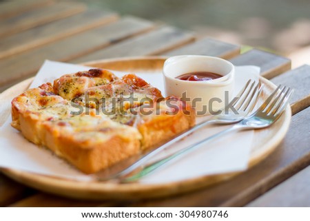 Pizza toasted bread with tomato sauce and ham cheese selective focus - vintage style effect picture