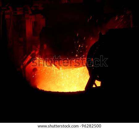 Pouring of liquid metal in open hearth workshop of the metallurgical plant