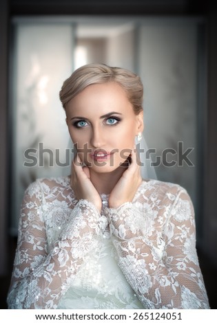 Portrait of the bride -bride in an expensive wedding dress.Portrait of the bride with big eyes.Gorgeous bride