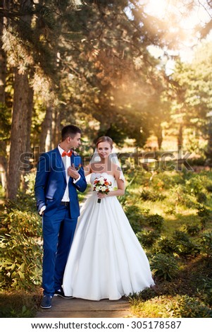 elegant bride in an expensive suit,wedding, the groom\'s suit, nature, love, wedding dress, bridal bouquet, beautiful couple, summer, celebration, holiday, walk wedding