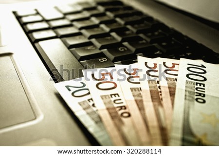 keyboard laptop and Euros.