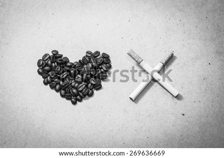 Love coffee beans and  crossed two cigarette , monochrome dark tone