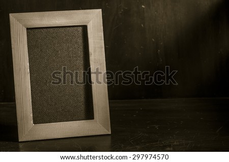 Still life with wooden frame and light