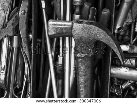 Black and white of Hammer in tools box, Old detail of used tools