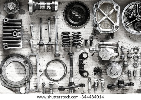 Old parts of motorcycles background with hard light black and white tone. repair and maintenance old parts of engine