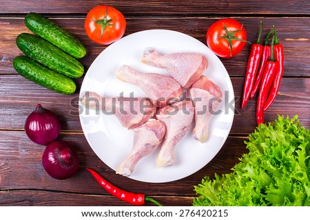 chicken legs fresh with vegetables