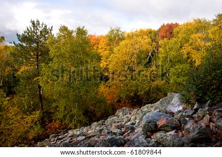 Photograph of an area of rock slide in a state park on Rib Mountain in north-central Wisconsin.  Taken during the peak of the autumn season with beautiful vibrant colors.