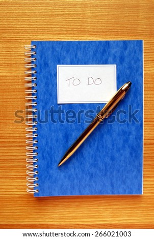 To Do List Book on Oak Desk
