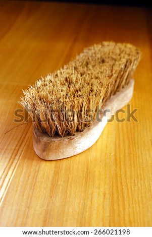 Old Fashioned Scrubbing Brush on New Oak Table