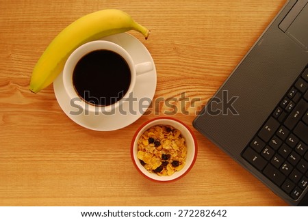 Breakfast at a Busy Worker\'s Desk or Home Office. Flexible Working Parents Awareness Day.