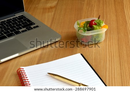 Healthy Salad Box on Busy Worker\'s Desk