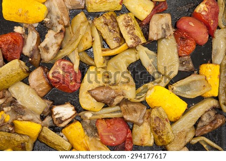 Roasted vegetables on a baking tray. Vegan food. Top view