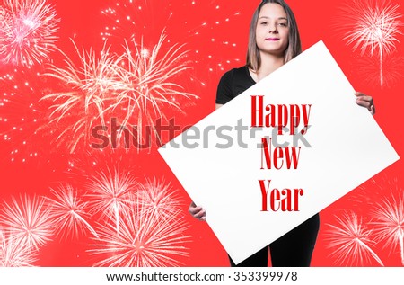 Girl with Happy New Year poster and fireworks