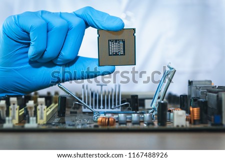 Close up portrait of computer engineer\'s hand is holding CPU\'s computer.