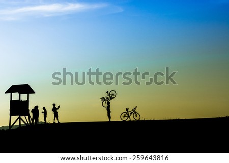 Outdoor mountain bike  - cyclists silhouettes on the background.(II)