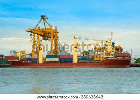 Cargo ship loading containers on schedule.